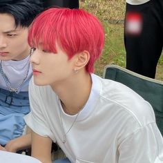 two young men sitting next to each other