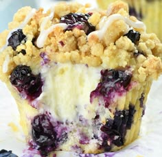 a close up of a blueberry crumb muffin