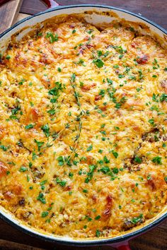 a casserole dish with cheese and parsley