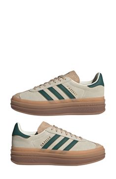 A triple-stacked platform elevates a time-tested sneaker, while serrated side stripes keep it close to its roots. Removable insole Leather upper/ synthetic and textile lining/ synthetic sole Imported Sporty Beige Platform Sneakers For Streetwear, Trendy Beige Platform Sneakers With Laces, Cream Platform Sneakers For Streetwear, Sporty Beige Platform Sneakers, Adidas Gazelle Platform, Gazelle Platform, Adidas Gazelle Bold Cream Green, Adidas Gazelle Bold, Sneaker Trends