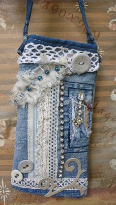 a purse made out of old jeans and buttons