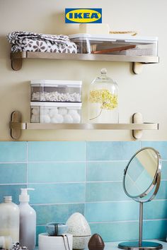 two shelves above a sink filled with bathroom items