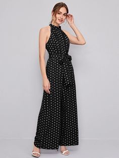 This incredible belted, cut-out, button, pleated, and zipper sleeveless halter Belted Polka Dot Halter Neck Jumpsuit is the perfect addition to any wardrobe. Made from a non-stretch fabric, this dress features a high waistline that cinches the waist and accentuates any figure. The unique cut-out design and pleated detailing along the front and back of the dress add a special touch of elegance. Specifications: Details: Belted, Cut Out, Button, Pleated, Zipper Sleeve Length: Sleeveless Neckline: Halter Fabric: Non-Stretch Waist Line: High Waist Fit Type: Regular Fit Composition: 90% Polyester, 6% Viscose, 4% Elastane Care Instructions: Machine wash or professional dry clean Product Measurements(cm): Size US Belt Length Bust Hip Size Length Thigh Waist Size XS 2 200 84 103 143.4 67.3 67 S 4 2 Halter Neck Jumpsuit, Cute Modest Outfits, Off Shoulder Jumpsuit, Floral Print Pants, Halter Jumpsuit, Cut Out Design, Wide Leg Jumpsuit, Modest Outfits, Halter Neck