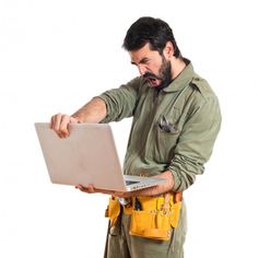 a man in overalls holding a laptop and looking at the screen with five stars above him