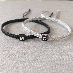 "Add to cart and write in the note to seller initials you need. You will receive: -Two adjustable knotted bracelets in the colors of your choice, -Organza bag, ready for gift giving! Materials: - Highest quality nylon cord and . Choose the bracelet color from the drop-down menu. Size: - Woman size adjustable approx. from 7\" up to 11\". - Man size adjustable approx. from 7,5\" up to 12\". - My sizes will fit most people, but if you are unsure and require bracelets for particularly large or small Adjustable Initials Bracelet For Friendship, Personalized Silver Braided Bracelet Minimalist Style, Personalized Silver Braided Minimalist Bracelet, Handmade Black Bracelet For Birthday Gift, Customizable Letter Bracelets For Friendship, Adjustable Black Jewelry With Initials, Personalized Silver Braided Bracelets For Friendship, Minimalist Initials Bracelet With Adjustable Fit, Minimalist Personalized Braided Bracelets As Gift