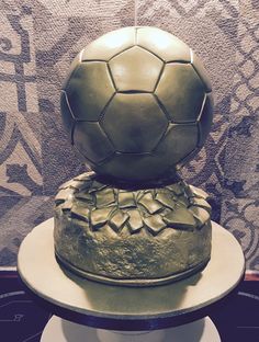 there is a cake with a soccer ball on top