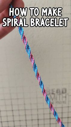 a hand holding a blue and pink rope with the words how to make spiral bracelet on it