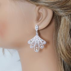 These Beautiful Romantic Swarovski Crystal BRIDAL Leaves Drops Peacock Earrings are made of very fine quality of Swarovski Crystals available in Silver finish for your special day! Even we have hard time taking pictures because of their shine 😄 so we want to shine our brides on their special days. The material used in these earrings are free from Lead, Nickel, Cadmium so it will not give you any skin irritation and environment friendly too.. ► ABOUT YOUR ORDER * All items are neatly packaged in Hand Set Cubic Zirconia Chandelier Earrings, Elegant Hand-set Diamond Earrings For Wedding, Evening Cubic Zirconia Bridal Earrings, Elegant Hand Set Diamond Earrings For Wedding, Glamorous Sterling Silver Chandelier Earrings For Wedding, Glamorous Sterling Silver Wedding Chandelier Earrings, Elegant Drop Earrings For Wedding Reception, Elegant Hand Set Chandelier Earrings For Wedding, Wedding Crystal Diamond Earrings (pierced)