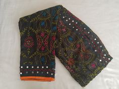 Beautiful ethnic raw  (chanderi) silk phulkari pants , embroidery with multicolor wool handcrafted with lining inside.Best quality. This pant gives a good ethnic look when paired with plain chikan Kurtas or plain kurtas.This pant has a mirror kind of ornamentation on below to give rich look. Length 39 inches Size L is ( US 10-12 sizes)          Black 2 sizes( L and XL)          Red fits M,L          Royal blue M,L          Beige fits M,L          Yellow fits S          Pink  M,L          Purple Bollywood Style Festive Bottoms With Mirror Work, Festive Bollywood Bottoms With Mirror Work, Traditional Chanderi Pants With Zari Work, Festive Chanderi Pants With Resham Embroidery, Traditional Multicolor Festive Pants, Bollywood Style Festival Pants With Dupatta, Festive Chanderi Pants, Bollywood Style Festive Pants With Zari Work, Bollywood Style Embroidered Festive Bottoms