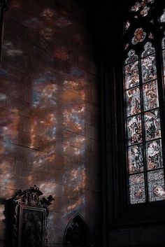 the sunlight is shining through stained glass windows