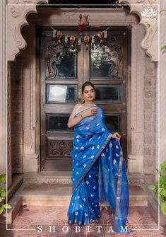 The sight of these flowers will take you to a nostalgic past! Paarijat - the eternal flower charms us with its fragrance and distinct orange stem! Presenting a pretty blue silk linen saree with Parijat- the eternal flower motifs embroidered on it.  The saree is ready to wear with falls and pico done. Look at those long tassels that dangle playfully from the pallu. An unstitched blouse fabric is included. Note: There may be slight color variations due to variation in screen settings and other fac Elegant Blue Saree With Chikankari Embroidery, Blue Slub Silk Saree With Cutdana, Blue Slub Silk Saree For Festivals, Blue Chanderi Saree With Chikankari Embroidery, Blue Slub Silk Saree For Puja, Blue Slub Silk Dupatta For Puja, Blue Slub Silk Saree For Diwali, Elegant Blue Slub Silk Saree, Blue Handloom Tissue Silk Traditional Wear