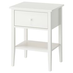 a white night stand with two drawers and one drawer on the bottom, in front of a white background