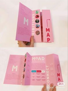 someone is holding an open pink book with buttons on the cover and inside, while another person holds it in their hand