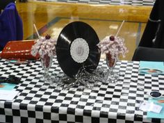 a table topped with black and white checkered cloth