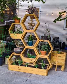 several wooden planters stacked on top of each other