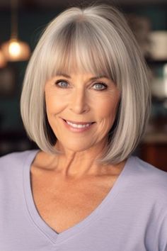 A medium-layered bob with side bangs is a timeless and versatile hairstyle for women over 70. This haircut adds texture and volume, which is beneficial for fine or thin hair types. Click here to check out more flattering hairstyles for women over 70. Hairstyle Older Women, Medium Bob With Layers, Bob With Side Bangs, 70 Style, Grey Hair Looks, Hairstyle For Women, Soft Bangs, Flattering Hairstyles, Chin Length