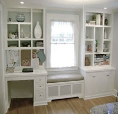 a room with some shelves and a bench in the corner, along with bookshelves