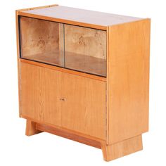 a wooden cabinet with two glass doors on the front and bottom shelves, against a white background