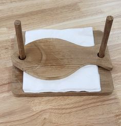 a piece of wood sitting on top of a white napkin