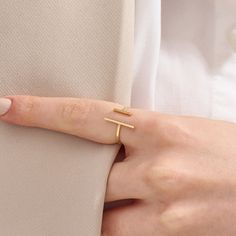 Introducing our Plain Cuff Ring, a minimalist masterpiece. Crafted in your choice of 14k solid gold, this unique open T-bar ring features an adjustable double bar design. Its simplicity and asymmetry make it an elegant choice for women who appreciate contemporary jewelry.  The ring can be made with yellow, rose, or white gold, please choose your size from the dropdown menu options above. 𝐑𝐢𝐧𝐠 𝐃𝐞𝐭𝐚𝐢𝐥𝐬 ❥ Solid gold, available in 10, 14 & 18 karats. ❥ Gold Color Options: White Gold, Yell Minimalist Yellow Gold Initial Ring With Open Band, Modern Yellow Gold Initial Ring With Open Band, Minimalist Open Initial Ring, Modern 14k Gold Open Midi Rings, Modern 14k Gold Midi Rings, Modern Yellow Gold Open Midi Rings, Modern Initial Ring With Simple Open Design, Modern Initial Ring With Open Design, Modern Open Initial Ring With Simple Design