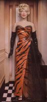 a mannequin dressed in an orange and black dress