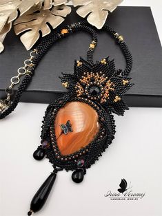 Large Black Orange Flower Pendant OOAK Orange Necklace OOAK - Etsy Handmade Orange Beaded Pendant Necklace, Black Carnelian Jewelry For Gifts, Handmade Black Agate Beaded Necklaces, Gift Necklace With Orange And Black Beads, Orange Necklace With Black Beads For Gift, Artisan Orange Beads, Gems, And Cabochons For Gifts, Unique Black Cabochon Necklace, Black Agate Beaded Necklaces, Handmade Bohemian Onyx Beaded Necklace