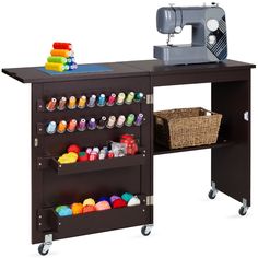 a sewing machine sitting on top of a wooden table next to a shelf filled with craft supplies