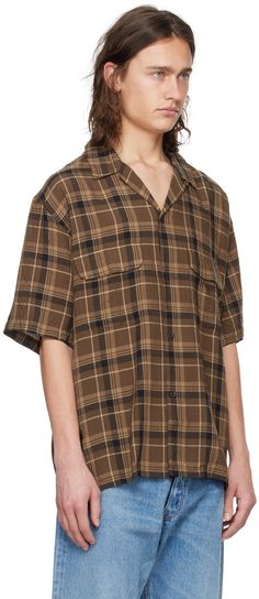 Lightweight rayon piqué shirt. Jacquard plaid pattern throughout. · Open spread collar · Button closure · Flap pockets · Tennis-tail hem Supplier color: Brown plaid Plaid Camp Collar Tops With Relaxed Fit, Plaid Relaxed Fit Short Sleeve Button-up Shirt, Relaxed Fit Plaid Short Sleeve Button-up Shirt, Plaid Collared Shirt With Placket, Collared Plaid Shirt With Placket, Plaid Collared Shirt, Relaxed Fit Plaid Collared Short Sleeve Shirt, Plaid Collared Short Sleeve Shirt With Relaxed Fit, Relaxed Fit Collared Short Sleeve Plaid Shirt