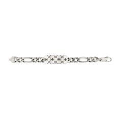 Style ‎728264 J8400 0728The historical GG motif appears alongside a favorite House symbol, the bee.The contemporary feel to the design echos the gender-fluid approach that is seen throughout the collection. The two engraved emblems feature as the defining design detail of this sterling silver bracelet.925 sterling silverGG and bee engravingAged silver-toned hardwareClasp closureMade in Italy Gucci Sterling Silver Bracelet, Engraved White Gold Gucci Jewelry, Luxury Gucci Chain Bracelet As Gift, Luxury Gucci Chain Bracelet, Gucci White Gold Bracelets For Formal Occasions, Gucci White Gold Bracelet For Formal Occasions, Gucci Sterling Silver Luxury Bracelets, Luxury Gucci Sterling Silver Bracelets, Elegant Gucci Sterling Silver Bracelets