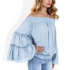 The Anna-Kaci Women's Off-Shoulder Bell Sleeve Top with Textured Dobby Pattern and Smocked Neckline is a feminine and elegant piece that adds a touch of boho-chic to your wardrobe. Crafted from lightweight, breathable fabric, this top features a textured dobby pattern that adds subtle sophistication. The smocked neckline allows for a comfortable off-shoulder fit, while the dramatic bell sleeves add a flowy and romantic vibe. Perfect for date nights, casual outings, or special occasions, this top Light Blue Smocked Top For Summer, Spring Off-shoulder Blouse With Smocked Back, Off-shoulder Smocked Top With Smocked Cuffs For Summer, Off-shoulder Blouse With Smocked Bodice For Day Out, Off-shoulder Blouse With Smocked Back For Day Out, Spring Long Sleeve Off-shoulder Top With Smocked Bodice, Off-shoulder Tops With Smocked Bodice For Vacation, Blue Off-shoulder Long Sleeve Top For Summer, Blue Long Sleeve Off-shoulder Top For Spring