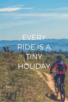 a man riding a bike down a dirt road with the words every ride is a tiny holiday