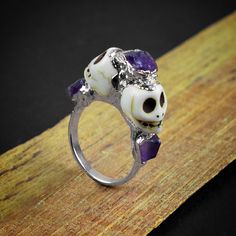 GemFormingStudio D E T A I L S Natural Purple Amethyst Skull Horror Handmade Multi-Stone Rough Gemstone Statement Ring for her , Engagement Ring Stone MM : 5 X 4 MM ( Approx ) Ring Size : (See all the variations) Weight : 3.88 gm Color : Multi Color Shape : Skull Shape Material : Copper Polish : All Polish Available Listing link for tourmaline skull earring : - https://www.etsy.com/listing/992470093/tourmaline-stud-earring-skull-stud?ga_search_query=skull&ref=shop_items_search_2&pro=1&am Collectible Halloween Skull Ring, Collectible Skull Rings For Halloween, Collectible Skull Ring For Halloween, Skull Shaped Ring As Halloween Gift, Unique Skull Shaped Anniversary Rings, Unique Sterling Silver Halloween Rings, Unique Sterling Silver Rings For Halloween, Skull Halloween Promise Ring, Unique Skull Ring For Wedding