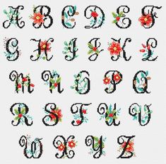 cross stitch alphabet with flowers and leaves on the upper letter, which has been digited