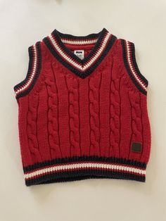 Janie and Jack Infant Boys Red Sweater Vest Size 3-6 Months Red Cable Knit Navy White and Red Striped trim around neck and sleeve openings Good preowned condition - no holes, stains or snags - see photos Size 3-6 Months Check measurements to ensure fit See photos actual measurements Armpit to armpit 10" Back of neck to hem 11 1/2" Ships US Mail - we ship out FAST - same day or next business day Shopify Balance, Cable Knit Sweater Outfit, Red Sweater Vest, Sweater Outfits Men, Red Cable Knit Sweater, Knit Sweater Outfit, Mens Fashion Wear, Sweater Vests, Stylish Men Casual