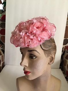 "Vintage 1950's 1960's Petite and Sweet Pink floral hat. The label is *Miss Sally Victor* New York. To keep hat on your head, you would need to use a hatpin (Not Included). *MORE INFORMATION BELOW* CONDITION: No issues noted. MEASURES: Inside circumference-16\" Front to back-6\" Left to right-6\" *WE APOLOGIZE~BUT WE NO LONGER SHIP TO GERMANY, ITALY OR SPAIN. IF ORDERS COME IN FROM GERMANY, ITALY OR SPAIN, WE WILL HAVE TO CANCEL THEM AND REFUND YOUR MONEY. SORRY FOR THIS INCONVENIENCE*" Vintage Fitted Pink Headpiece, Vintage Pink Fitted Headpieces, Fitted Vintage Pink Headpiece, Pink Vintage Fitted Headpiece, Spring Wedding Retro Fascinator, Vintage Pink Fitted Fascinator, Vintage Spring Party Costume Hats And Headpieces, Vintage Summer Church Fascinator, Spring Vintage Costume Hats And Headpieces For Party