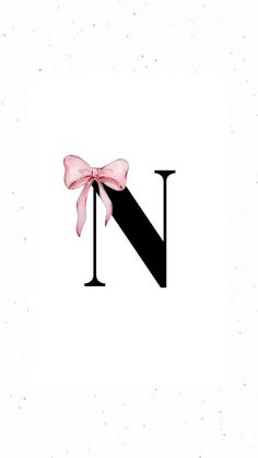 the letter n has a pink bow on it