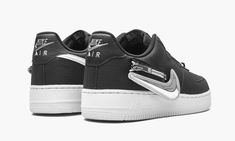 The Nike Air Force 1 Low “Zip Swoosh - Black/Silver” is a modified look for the classic, ‘80s-era performance basketball shoe by Nike that includes interchangeable Swooshes that zip into the shoe. A progressive, contemporary style, the “Zip Swoosh” colorway features a black tumbled leather base that allows for the rest of the shoe’s modern details to attract attention. And that they do. White, Laser Crimson, and Metallic Silver Swooshes are included with the shoe and each can be zippered into th 80s Era, Nike Air Force 1 07, Nike Air Force 1 Low, Stadium Goods, Air Force 1 Low, Silver Shoes, Black Metallic, Black Nylons, Nike Air Force 1