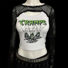 * Sublimated green psychobilly horror punk band cropped tank top * Mannequin is wearing size S * Mannequin measurements:    * Bust: 35" (C cup)    * Waist: 26"    * Hip: 40" * Soft, breathable, and stretchy material * For a looser fit, size up * Please note that all items are Made to Order & there may be slight variations in appearance Edgy Halloween Vest For Alternative Fashion, Punk Style Crop Top For Festival, Punk Style Tank Top For Concerts, Punk Style Cotton Crop Top For Concerts, Punk Style Vest For Summer Concert, Punk Style Tank Top For Summer Music Festival, Punk Tank Top For Spring Concert, Fitted Punk Style Screen Print Tops, Punk Style Tank Top For Spring Concert