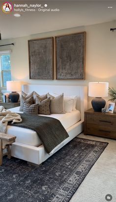 a large bed sitting in a bedroom on top of a blue and white carpeted floor