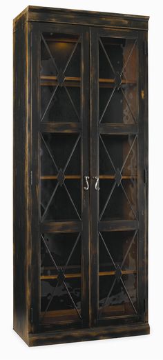 an old wooden bookcase with glass doors on the front and bottom shelves, is shown