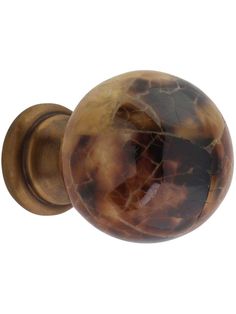 an antique style door knob with a marbled design