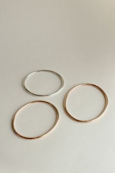 The Georgia is a timeless, minimalist bracelet style with an organic oval shape designed for constant wear. It is comfortable enough to wear even while sleeping, yet strong enough to gracefully withstand years of daily use. Each hand-soldered bracelet is shaped to mimic the contours of your forearm. Available in durable 14k gold fill, solid sterling silver, and solid 14k gold. These materials are water resistant and low maintenance. For more information, visit our Metals Encyclopedia. ✦ SIZING ( Modern Rose Gold Bangle For Everyday, Modern Stackable Bangle For Everyday, Everyday Round Band Bracelets, Modern Rose Gold Bracelets For Everyday Wear, Minimalist Oval Bangle As A Gift, Minimalist Oval Bangle As Gift, Minimalist Oval Bangle Gift, Minimalist Oval Bracelets For Everyday Wear, Simple Everyday Stackable Bracelets