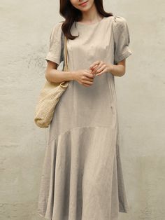 Cotton Solid Ruffle Short Sleeve Round Neck Casual Midi Dress Casual Pleated Hem Dress For Brunch, Casual Dress With Pleated Hem For Brunch, Casual Knee-length Midi Dress With Ruffle Hem, Casual Brunch Dresses With Pleated Hem, Beige Short Sleeve Midi Dress With Ruffles, Solid Color A-line Midi Dress With Ruffles, Beige Midi Dress With Ruffles And Short Sleeves, Casual Solid Color Tiered Midi Dress, Casual Solid Color Dresses With Ruffles