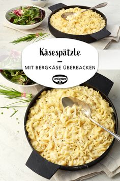 two pans filled with macaroni and cheese on top of a white table