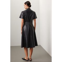 Black faux leather (100% Polyurethane) Midi dress. V-Neckline. Short Sleeves. Back zipper closure. 40" shoulder to hemline. Imported. Leather Midi Dress For Work, Fitted A-line Leather Dress, Sleek Leather Workwear Dress, Sleek Leather Dresses For Workwear, Sleek Leather Dress For Work, Sleek Leather Dress For Fall, Sleek Faux Leather Dresses For Fall, Fitted Leather Midi Dress, Leather Midi Dress For Fall