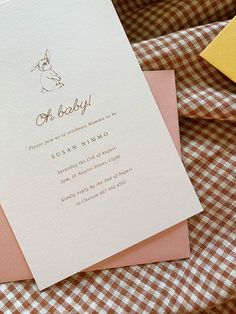 a baby shower is shown with pink and yellow cards