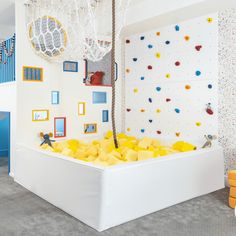 a child's play room with climbing walls and toys