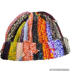 multicolored knitted beanie hat on white background with clipping for text