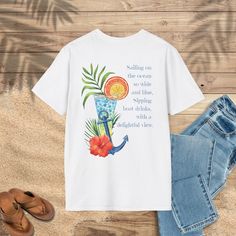 "Sailing on the ocean so wide and blue, sipping boat drinks, with a delightful view." Discover the unique charm of our Slack Tide Collection tees, where every t-shirt is a blend of adventure, design, and quality. Inspired by my travels to breathtaking islands, each design captures the essence of wanderlust and the beauty of tropical landscapes. Our collection offers comfortable, stylish, and durable t-shirts that are perfect for any travel enthusiast. Whether you're exploring new destinations or reminiscing about past journeys, the Slack Tide Collection brings a touch of the islands to your everyday life. Shop our travel-themed t-shirts today and wear your passion for adventure proudly. Join our community of explorers and elevate your travel wardrobe with our Slack Tide Collection tees! ♥ Nautical Blue T-shirt For Summer, Blue Nautical T-shirt For Summer, Summer Boating T-shirt With Short Sleeves, Summer Short Sleeve T-shirt For Boating, Nautical Style Summer T-shirt With Letter Print, Nautical Style Letter Print T-shirt For Summer, Nautical Letter Print T-shirt For Summer, Summer Boating T-shirt With Crew Neck, Summer Crew Neck T-shirt For Boating