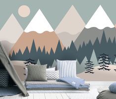 a living room with mountains and trees painted on the wall in pastel colors,